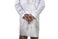 Back view of unidentified male medicine doctor holding stethoscope in his hand wearing medical gown