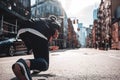 Back view on urban runner in start pose on city street Royalty Free Stock Photo