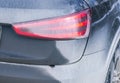 Back view of a very dirty car. Fragment of a dirty SUV. Dirty rear lights, wheel and bumper of the off-road car with swamp splashe Royalty Free Stock Photo