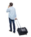 Back view of walking business man with suitcase talking on the phone Royalty Free Stock Photo