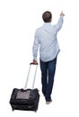 Back view of walking pointing business man with suitcase Royalty Free Stock Photo