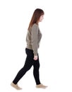 Back view of walking woman. beautiful blonde girl in motion. Royalty Free Stock Photo