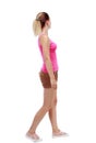 Back view of walking woman. beautiful blonde girl in motion. Royalty Free Stock Photo