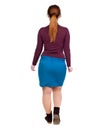 Back view of walking woman. beautiful blonde girl in motion. Royalty Free Stock Photo