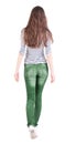 Back view of walking woman in jeans . Royalty Free Stock Photo