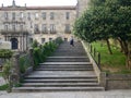 Back view of walking woman tourist on stone stair