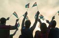 Back view waving indian flags.