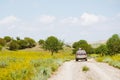 Back view 4WD vehicle drive on gravel road off-road in Vashlovani national park wilderness. Exploration tour remote outdoors in