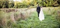 Bride and Groom walking in forest Royalty Free Stock Photo