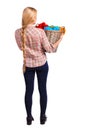 Back view of woman with basket dirty laundry. girl is engaged in washing. Royalty Free Stock Photo