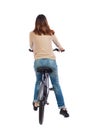 Back view of a woman with a bicycle.