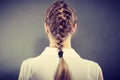 Back view of woman with blonde braid.