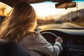 Back view of woman driving car for summer vacation travel. Car driving with safety on highway. Driver hand holding steering wheel Royalty Free Stock Photo