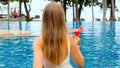 Back view of woman enjoy summer vacation in luxury beach resort Royalty Free Stock Photo
