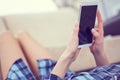 Back view of a woman hands using smart phone with blank screen close up. White phone with a black screen in the hands of Royalty Free Stock Photo