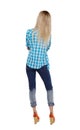 Back view of a woman in jeans.