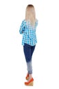 Back view of a woman in jeans.