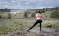 Back view of woman jogger stretching