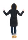 Back view of woman in parka thumbs up. Royalty Free Stock Photo