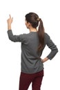 Back view of woman pointing at copy space