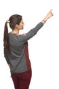 Back view of woman pointing at copy space