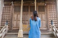 Back view of woman ringing the bell in Japanese temple Royalty Free Stock Photo