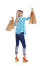 Back view of woman with shopping bags .