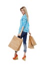 Back view of woman with shopping bags