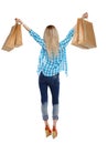 Back view of woman with shopping bags .