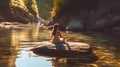 Back view of a woman sitting in the sun on a stone in a river