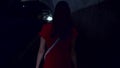 Back view of woman walk alone in tunnel at night. Scared female run fast from her pursuer at night