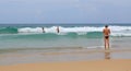 Back view of women at the beautiful scenery of beach