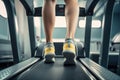 Back view of women feet and legs running on treadmill in fitness studio