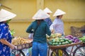 Back view of Women, Female street vendor in fruit, flowers market on the bike and street. Royalty Free Stock Photo