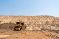 Back view of Yellow Excavator at sandpit. sand industry. at road construction site Royalty Free Stock Photo