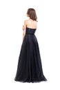 Back view of young beautiful woman in black evening dress Royalty Free Stock Photo