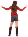 Back view of young brunette woman in jeans and sweater going Royalty Free Stock Photo