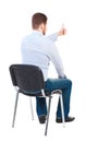 Back view of young business man sitting on chair and thumbs up. Royalty Free Stock Photo