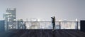 Back view of young businesswoman looking into the distance on rooftop with night sky and wide city view. Success, future and