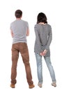 Back view of young couple hug and look into the distance. Royalty Free Stock Photo