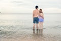 Back view Young Couple romantic travel honeymoon on Beach Royalty Free Stock Photo