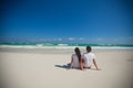 Back view of young couple sitting at tropical Royalty Free Stock Photo