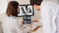 Back view of young doctors radiologists analises x-ray Royalty Free Stock Photo