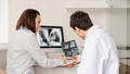 Back view of young doctors radiologists analises x-ray Royalty Free Stock Photo