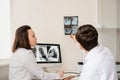 Back view of young doctors radiologists analises x-ray Royalty Free Stock Photo