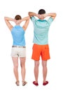 Back view of young embracing couple in shorts hug and look. Royalty Free Stock Photo