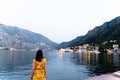 Back view of a young female admiring view of the Kotor Bay