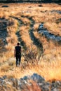 Back view of a young female hiker admiring the view in French Riviera backcountry