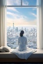 back view of young female wake up at luxury hotel room or apartment, woman by panoramic window, city and skyscrapers