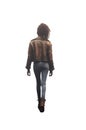 back view of a young girl child wearing a leather jacket and slim jean pants. Fashion black teen girl. Royalty Free Stock Photo